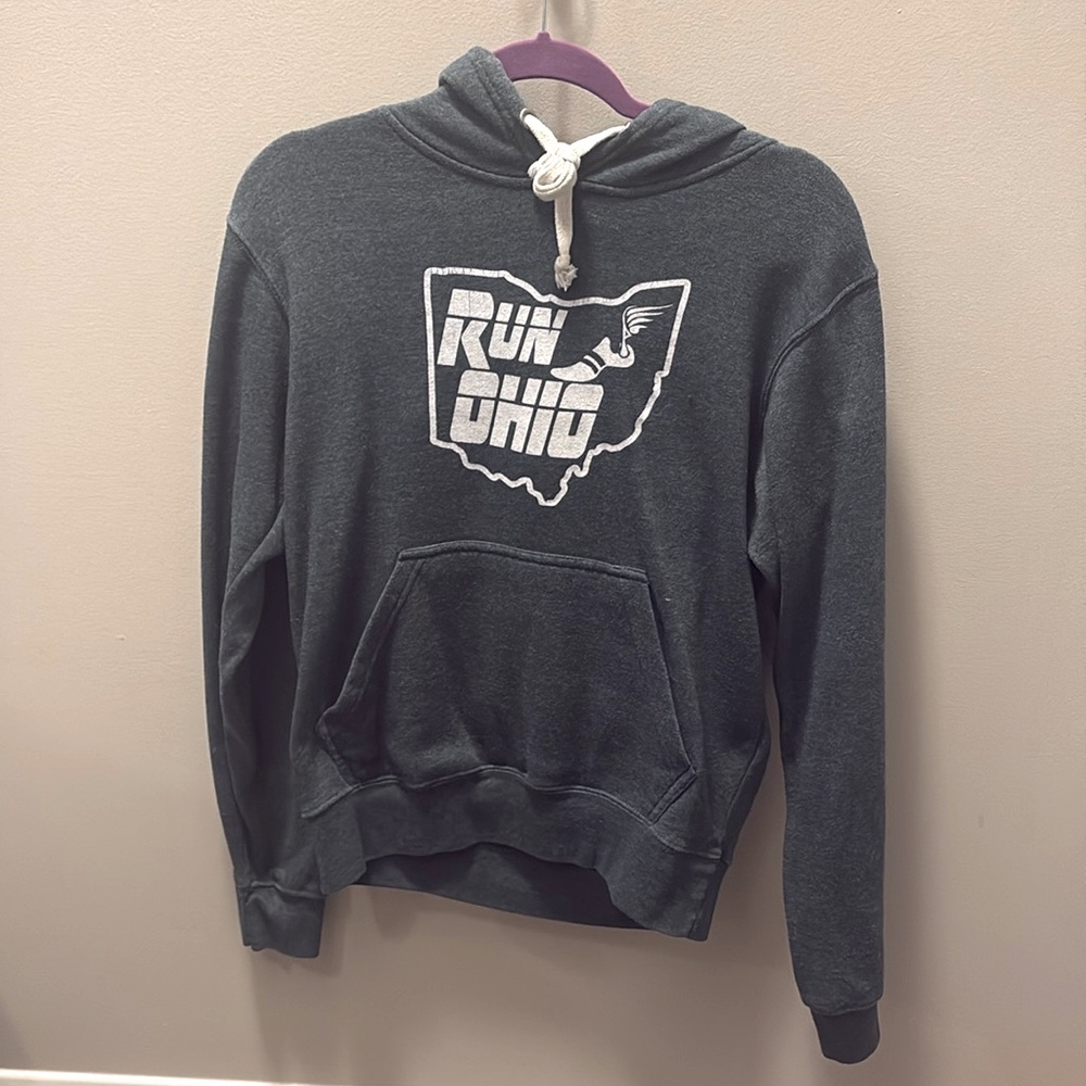 J. America size small “Run Ohio” hooded sweatshirt in color forest green.